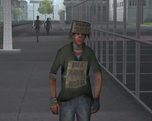 Man with signs on head and shirt.