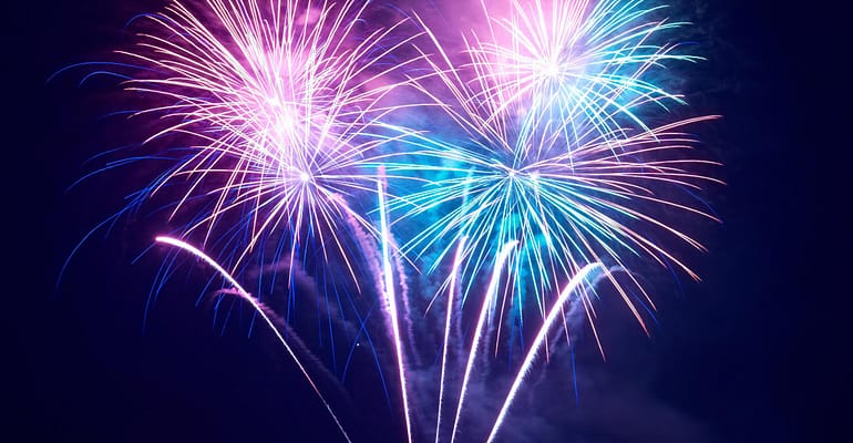 A bunch of fireworks are in the air