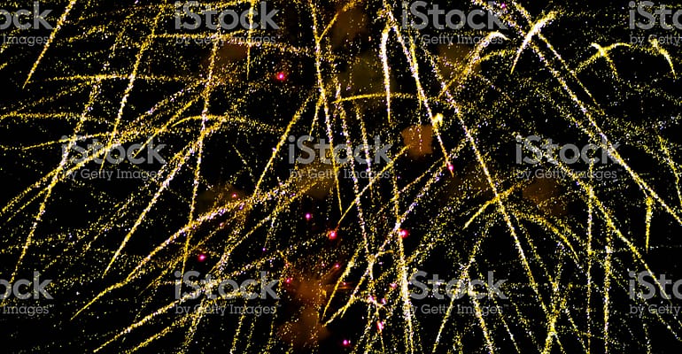 A bunch of fireworks are in the air