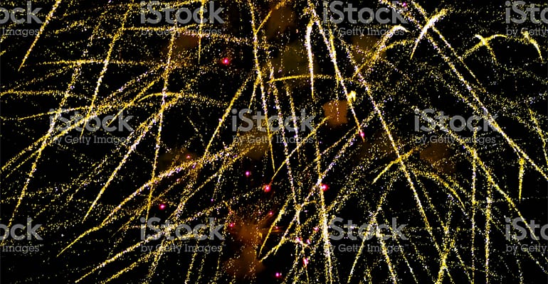 A bunch of fireworks are in the air